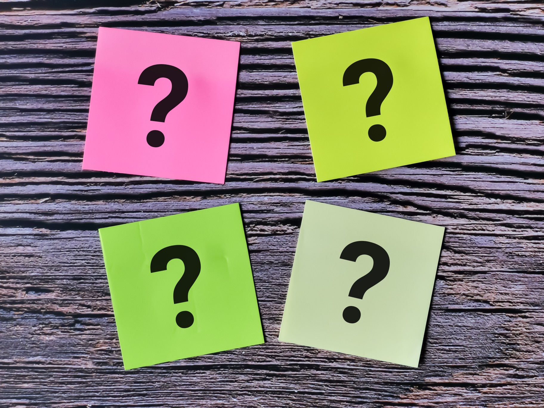 announcement-answer-ask-background-blank-board-brainstorming-bright-business-choice-concept-confusion_t20_dz6GzR question marks on four post-it notes